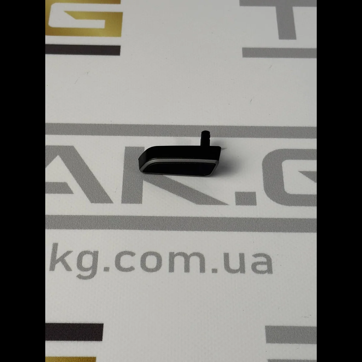 Кнопка регулювання сидіння пасажира вертикальна